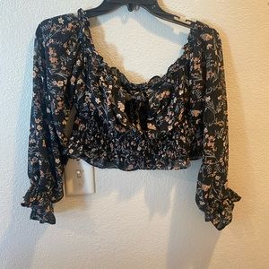 Nasty gal long sleeve crop blouse has tie hole in front and can be off shoulder